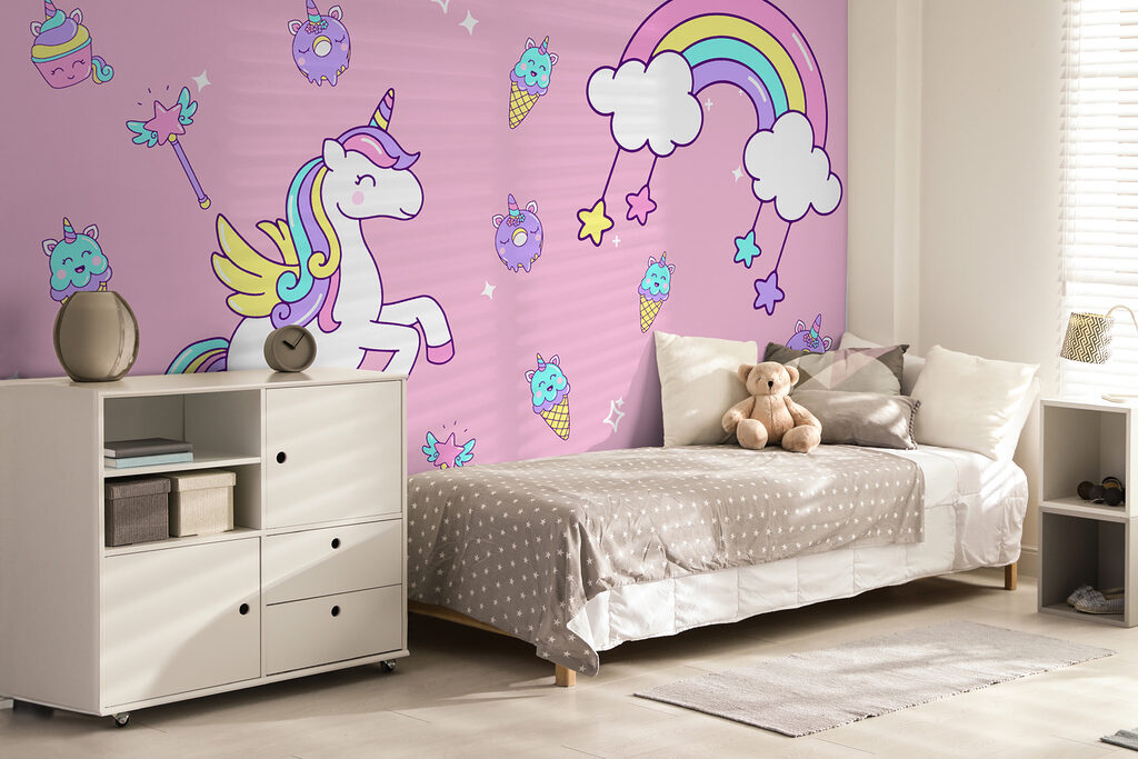 Unicorno tra dolcetti rosa in un ambiente